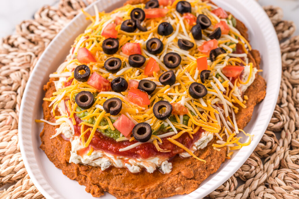 7 layer bean dip on white platter