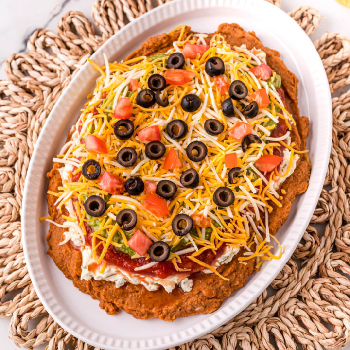 7 layer bean dip on white platter