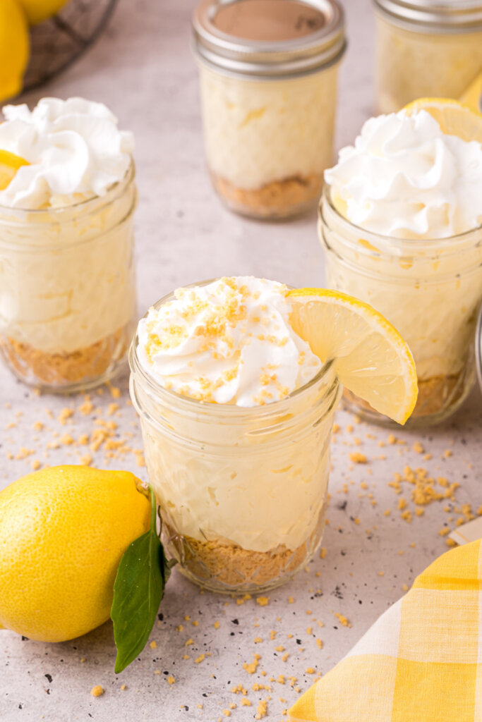 mason jars filled with no bake lemon cheesecake