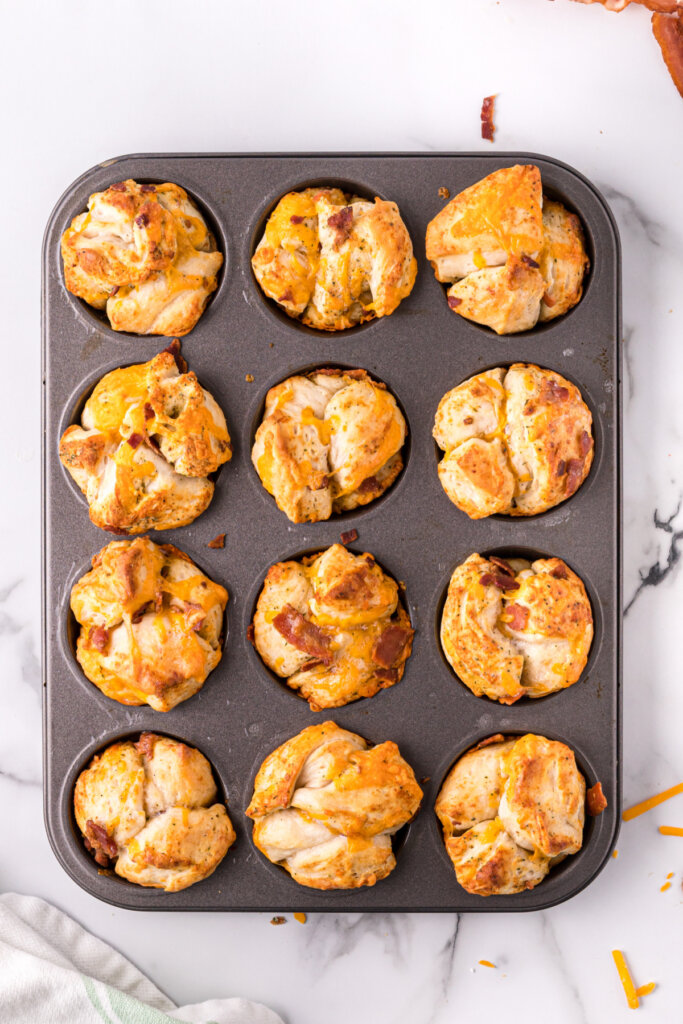 cheddar bacon ranch pull paart rolls in muffin tin after being baked
