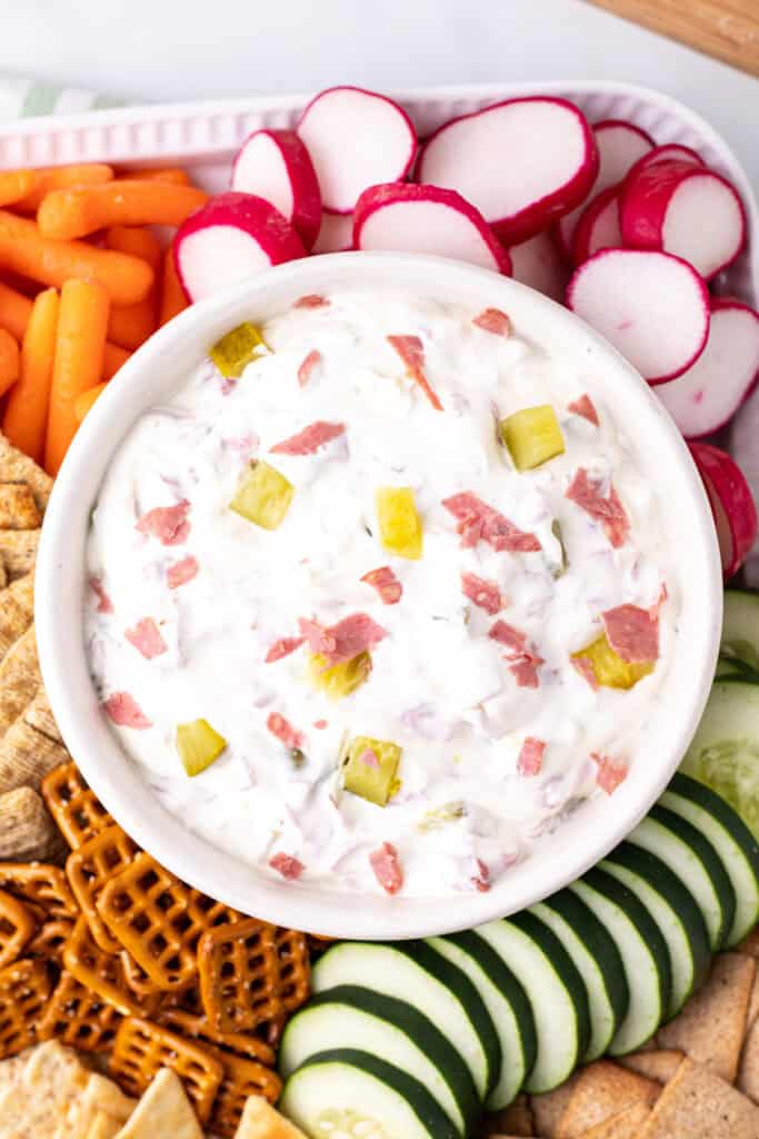Zoomed-in top view of dill pickle wrap dip showing chunks of pickles and dried beef
