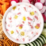 looking down on a closeup of dill pickle wrap dip in white bowl