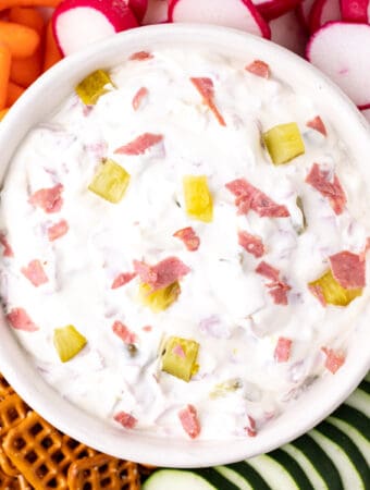 looking down on a closeup of dill pickle wrap dip in white bowl