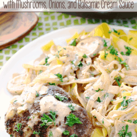 Italian Beef Patties with Mushrooms, Onions, and Balsamic Cream Sauce on a white plate.