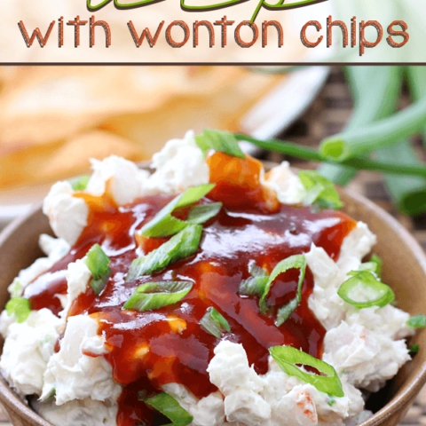 Crab Rangoon Dip with Wonton Chips in a brown bowl.