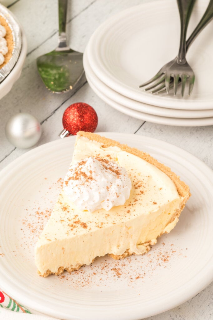 slice of no bake eggnog pie on white plate