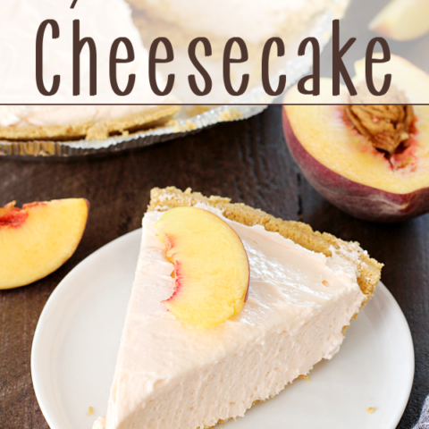 No-Bake Peach Cheesecake on a white plate with a peach sliced in half.