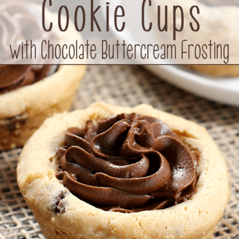 Chocolate Chip Cookie Cups with Chocolate Buttercream Frosting laying on a place mat.