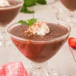 chocolate pudding garnished with whipped cream and mint