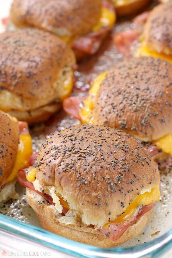 These easy crowd-pleasing Ham and Cheese Sliders are the perfect accompaniment to a bowl of soup - or serve them up on game day - for a winning recipe, everyone will love!