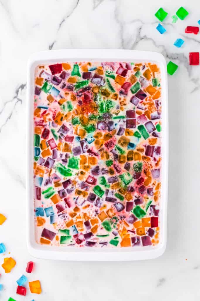 Top view of Broken Glass Jello dessert with colorful gelatin cubes in creamy white gelatin