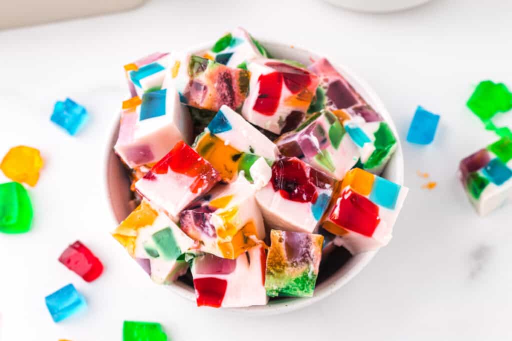 Broken Glass Jello dessert cubes served in a bowl with colorful stained glass gelatin pieces