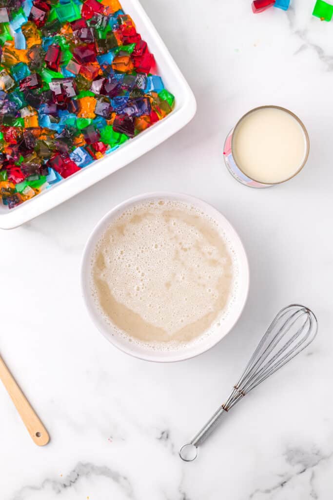 Gelatin and sweetened condensed milk mixture being prepared for Broken Glass Jello dessert