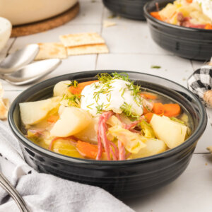 corned beef and cabbage soup in black bowl