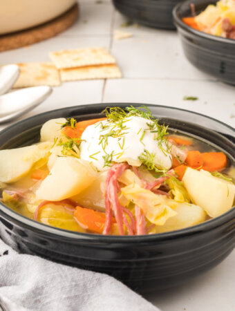 corned beef and cabbage soup in black bowl