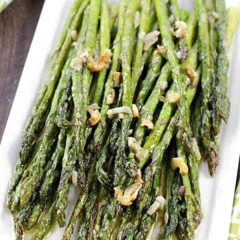 This Oven-Roasted Asparagus makes a quick and easy side dish for any meal. We especially enjoy this recipe in the Spring when asparagus is abundant. You'll be amazed at how a few simple ingredients turn asparagus into an addictively-delicious vegetable dish everyone will love!