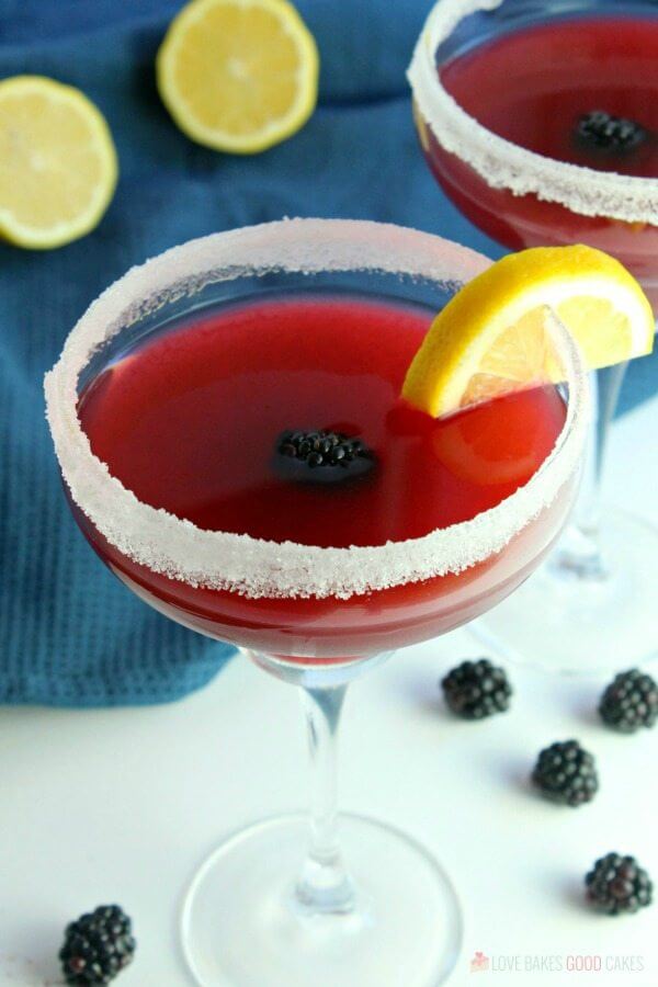 Blackberry Lemonade Margarita in two glasses with fresh fruit.