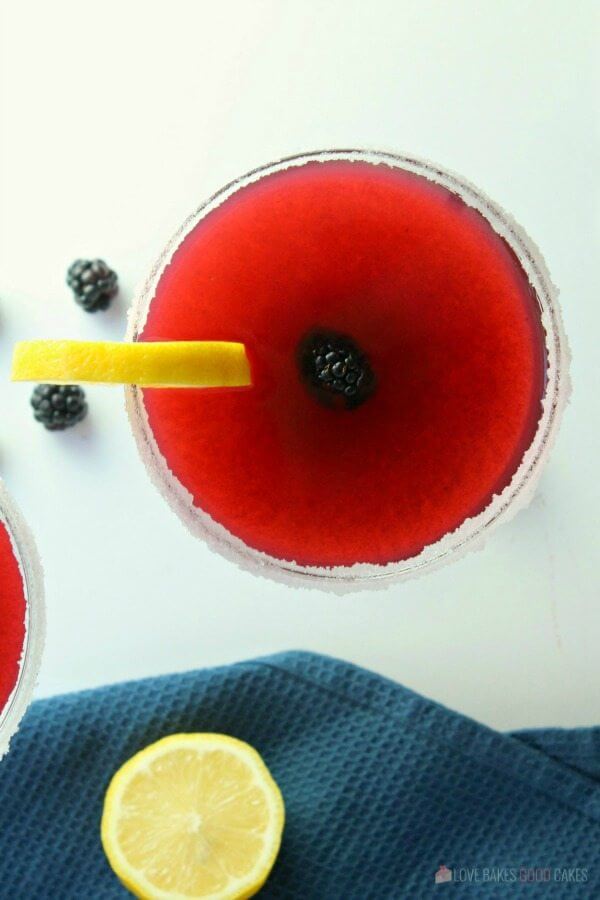 Blackberry Lemonade Margarita in a glass with fresh fruit.