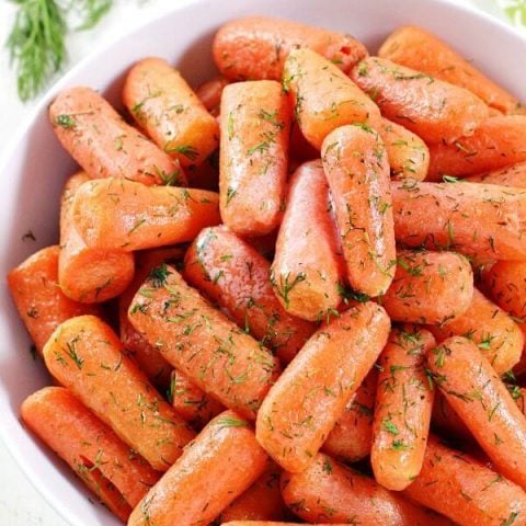 Take carrots to the next level with this Dill Butter Carrots recipe. Tender, sweet carrots pair perfectly with butter and dill in this quick and easy side dish.