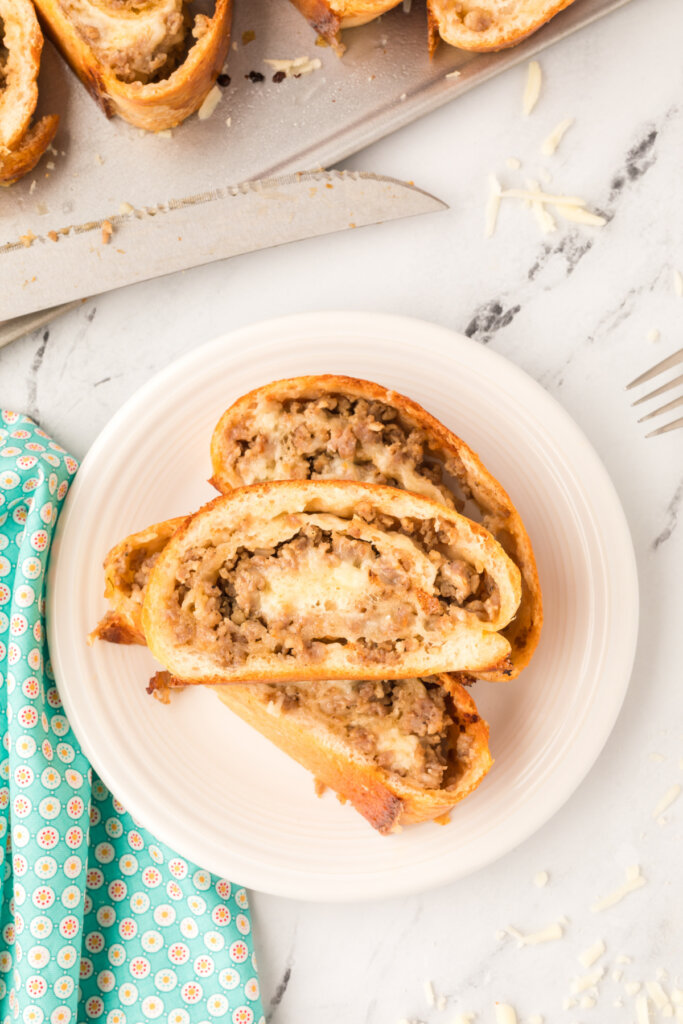 looking down onto plate with sausage bread slices