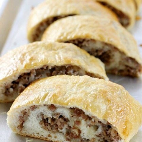 This Sausage Bread might just be the most versatile recipe in your recipe box! It's perfect as an appetizer, a weeknight dinner recipe, serve it on game day, or take it along on picnics or potlucks.