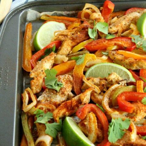 Get dinner on the table quickly with this Sheet Pan Chicken Fajitas recipe! Tender strips of chicken, bell pepper, and onion mingle in a tantalizing array of Mexican flavors. Serve with your favorite garnishments and (an optional) Margarita!