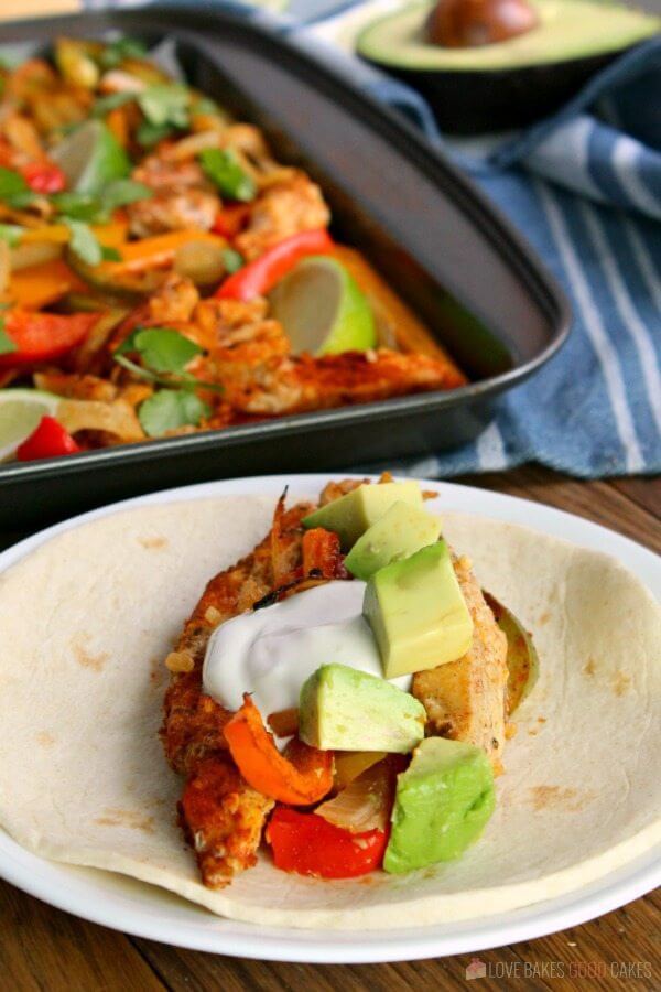 Sheet Pan Chicken Fajita on a flour tortilla.