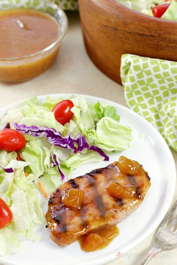 pork chop and salad on plate