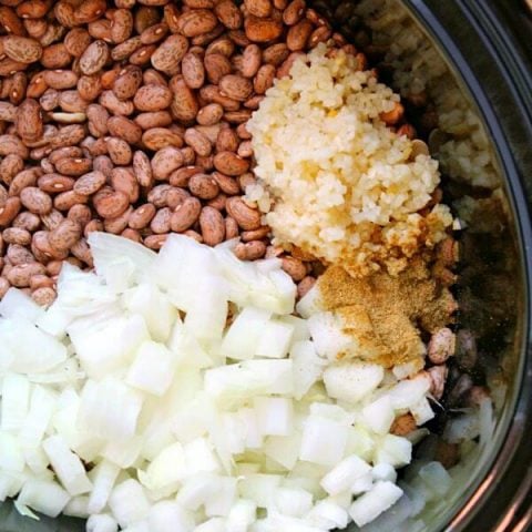 This Slow Cooker Refried Beans recipe is so easy to make! It's the perfect addition to - or side dish for - all of your Mexican dishes.