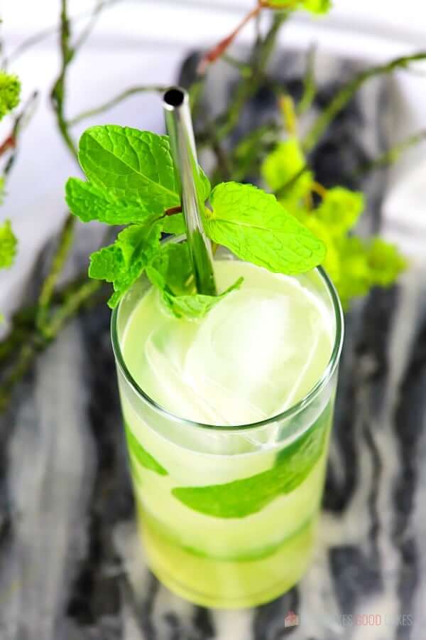 Pineapple Mojito (with Virgin "Nojito" Option) in a glass with a metal straw.