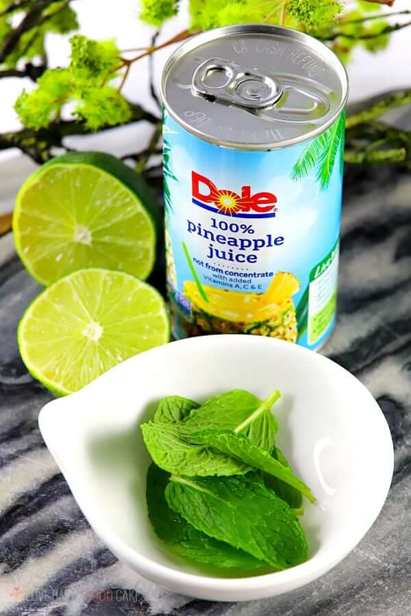 Pineapple Mojito (with Virgin "Nojito" Option) ingredients with limes and Dole Pineapple Juice.