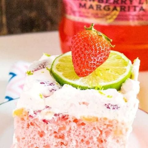 Get the party started with this Boozy Strawberry Margarita Poke Cake! Margarita mix and instant pudding amp up a boxed cake mix to become your new favorite summer dessert!
