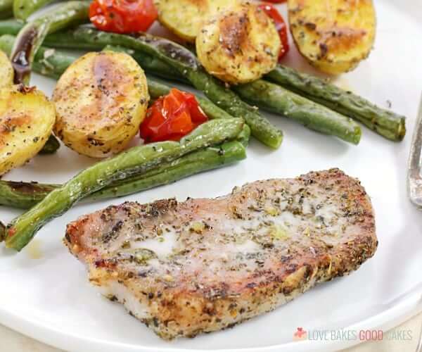 Italian Pork Chop Sheet Pan Dinner on a plate close up.