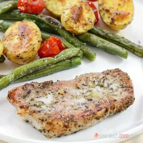 When you need to make mealtime quick and easy, give this Italian Pork Chop Sheet Pan Dinner a try! Italian-spiced Pork Chops bake with potatoes, green beans, and tomatoes for a supper everyone will love!