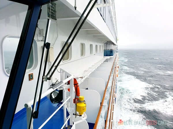 Looking at the private balconies of a cruise ship as it is underway.