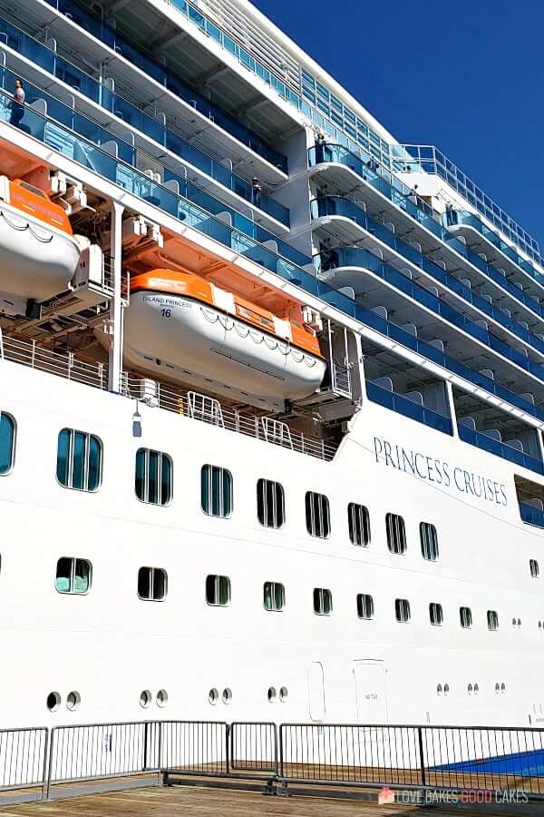 Looking up at a Princess Cruise Line ship from the ground.