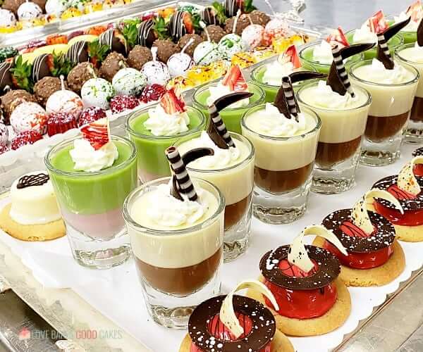 Various deserts on trays in the buffet restaurant of a cruise ship.