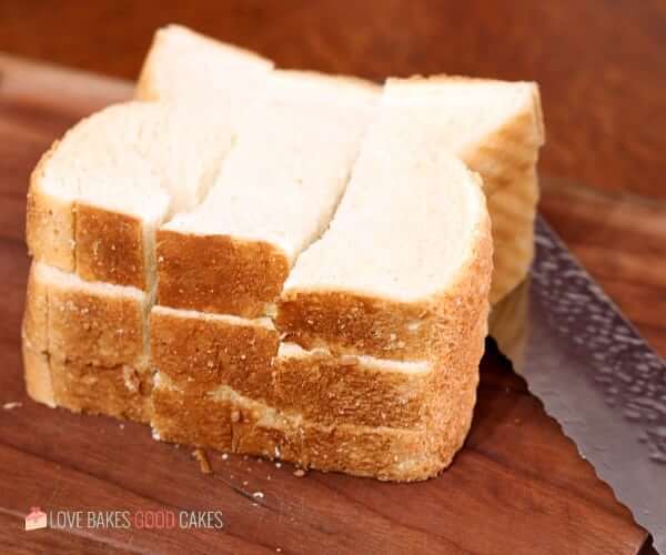 Bread slices cut into sections for Air Fryer French Toast Sticks.