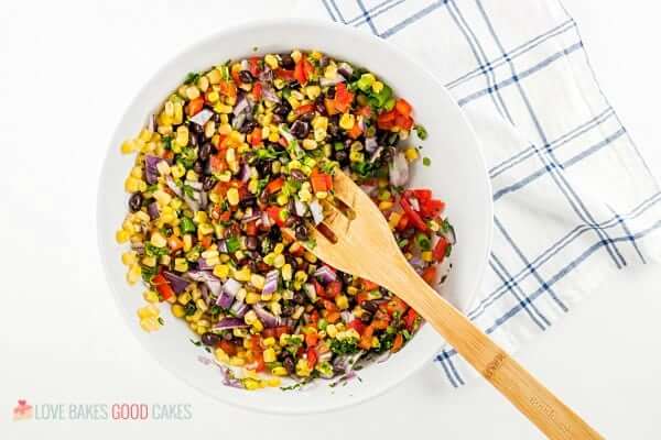 Black Bean and Corn Salsa in a bowl with a spoon.