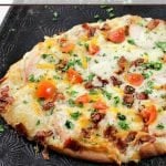 Add a new favorite to pizza night with this Chicken Bacon Ranch Naan Bread Pizza! This flavor combo pairs well on naan bread and makes the perfect pizza idea!