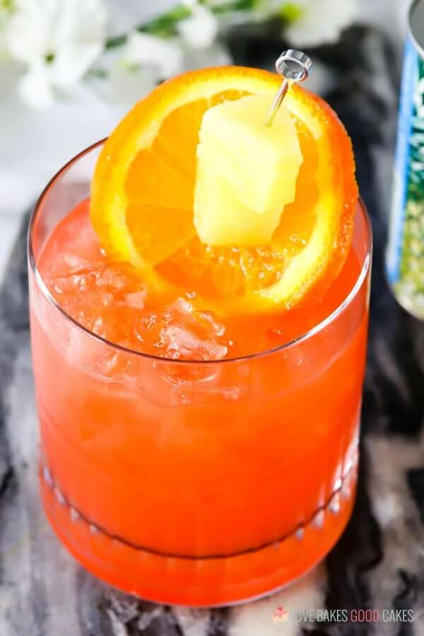 Orange and Pineapple Rum Punch in a glass close up.