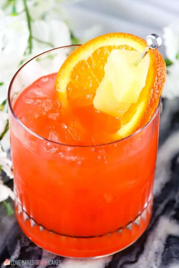 Orange and Pineapple Rum Punch in a glass close up.