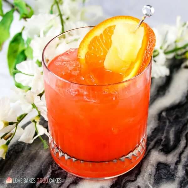 This Orange and Pineapple Rum Punch is the perfect adults-only refreshment on a hot summer day! Let the tropical flavors melt the stress away!