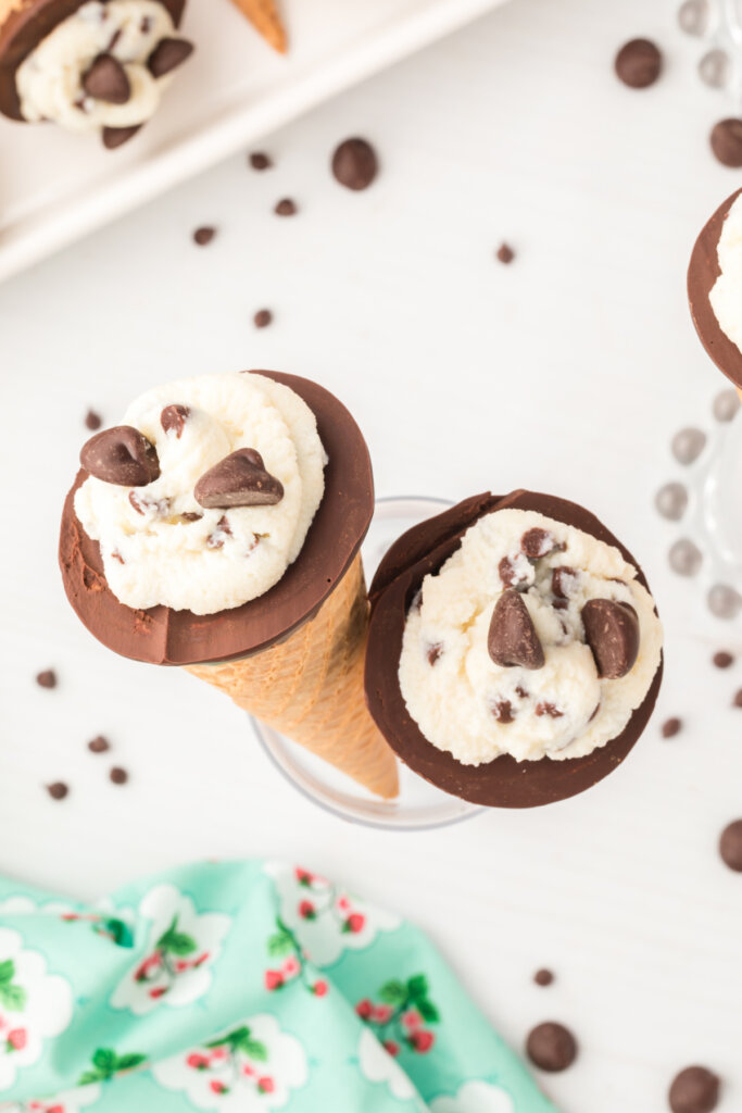 looking down onto two cannoli cones in a cup