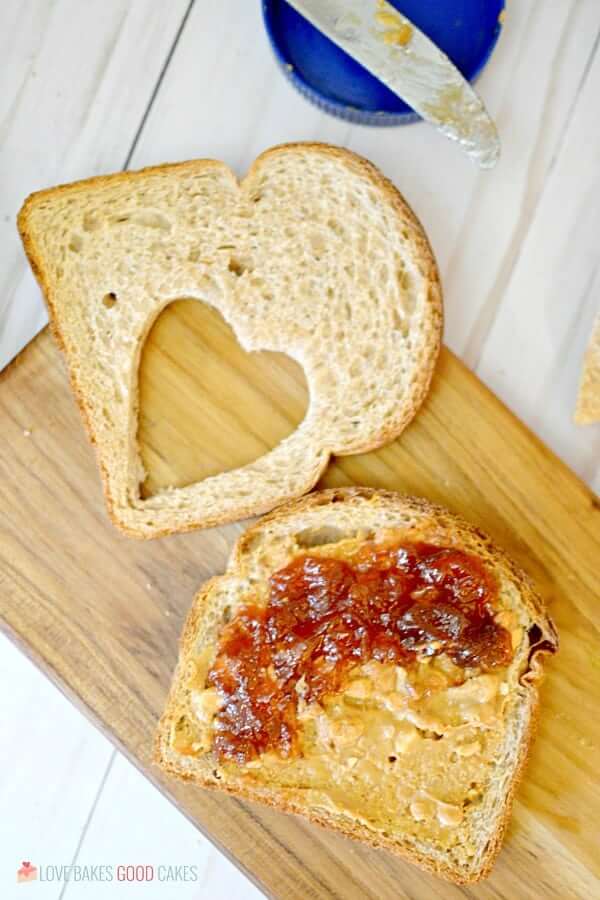 Fairy Sandwich bread slices on a cutting board with peanut butter and jelly.