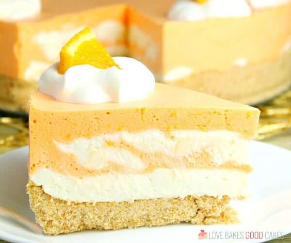 No-Bake Orange Creamsicle Cheesecake close up on a plate.