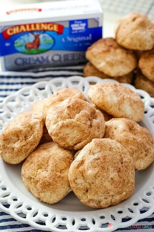 Snickerdoodle Cream Cheese Cookies piled up on a white plate.