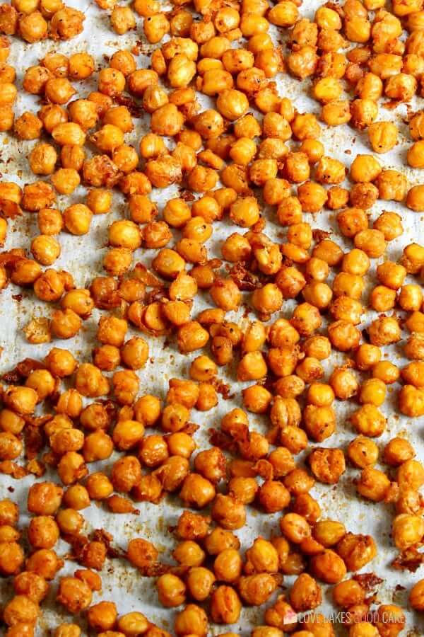 Spicy Roasted Chickpeas laying on a baking sheet.