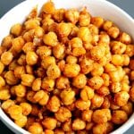 These Spicy Roasted Chickpeas are a healthy snack idea and the recipe only requires a few pantry staples. A delicious, high-protein snack.