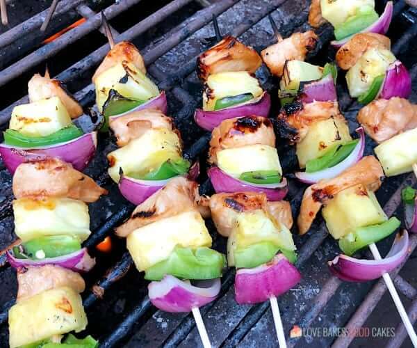 Hawaiian Chicken Kebabs cooking on the grill.